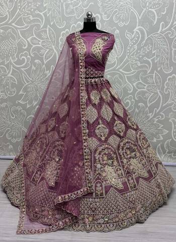For A Fancy Designer Look,Grab These Lehenga Choli With Dupatta in Fine Colored.These Lehenga And Choli Are Net And Dupatta Are Fabricated On Soft Net Pair.Its Beautified With Designer Peacock Pattern,Sequance,Multy Thread,Dori,Jari Embroidery With Diamond Work. 
