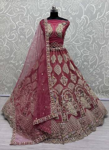 For A Fancy Designer Look,Grab These Lehenga Choli With Dupatta in Fine Colored.These Lehenga And Choli Are Net And Dupatta Are Fabricated On Soft Net Pair.Its Beautified With Designer Peacock Pattern,Sequance,Multy Thread,Dori,Jari Embroidery With Diamond Work. 