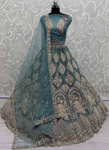 For A Fancy Designer Look,Grab These Lehenga Choli With Dupatta in Fine Colored.These Lehenga And Choli Are Net And Dupatta Are Fabricated On Soft Net Pair.Its Beautified With Designer Peacock Pattern,Sequance,Multy Thread,Dori,Jari Embroidery With Diamon