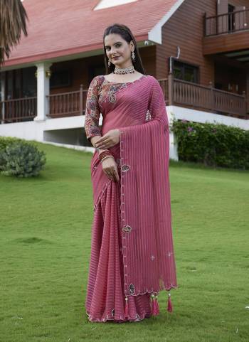 Looking These Party Wear Saree in Fine Colored Pair With Blouse.These Saree Are Georgette and Blouse Are Fabricated On Gajji Silk.Its Beautified With Wevon Lining Designer With Calcutta Zardishi,Diamond Hand Embroidery Work.