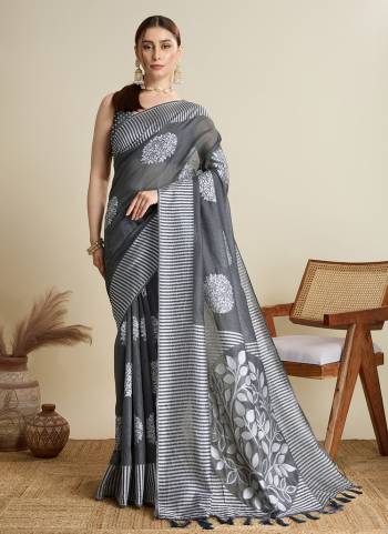 Garb This Party Wear Saree Paired With Blouse.This Saree And Blouse Are Soft Silk Fabric With Wevon Lining,Butti Designer. Buy This Pretty Saree Now.
