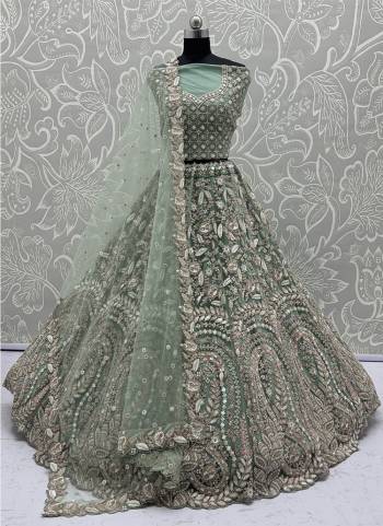 For A Fancy Designer Look,Grab These Lehenga Choli With Dupatta in Fine Colored.These Lehenga And Choli Are Net And Dupatta Are Fabricated On Soft Net Pair.Its Beautified With Fancy Designer Peacock Thread,Sequance,Dori Embroidery With Zarkan Diamond Work. 