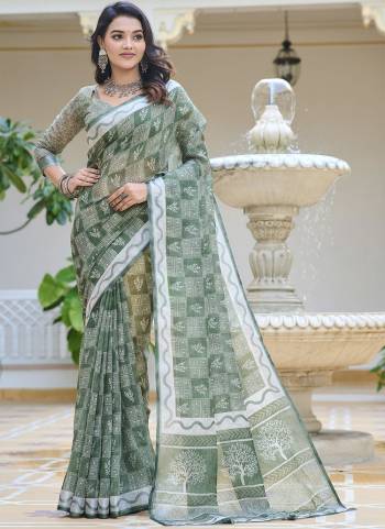 Garb These Fastive Saree in Fine Colored.These Saree Are Linen Cotton And Blouse is Fabricated On Linen Cotton Pair.Its Beautified With Wevon Jari Border With Designer Digital Printed.