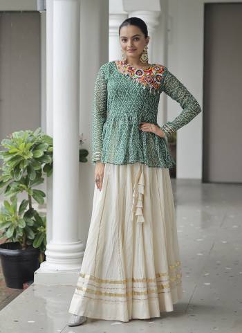 Looking These Navratri special Lehenga Choli in Fine Colored. These Lehenga Are Kora Cotton And Blouse Are Fabricated On Georgette Fabriced. It is Beautified With Designer Bandhani Printed With Traditional Kutchi Patch Work.