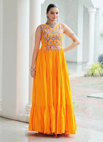 Garb These Beautiful Navratri Wear Readymade Long Gown.These Gown is Fabricated On Rayon.Its Beautified With Designer Kutchi Gamthi Embroidery Work.