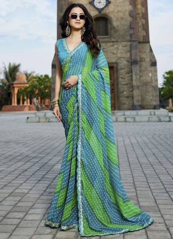 Attractive These Fancy Fastive Saree in Fine Colored.These Saree Are Georgette And Blouse is Fabricated On Art Silk Pair.Its Beautified With Disigner Bandhani,Laheriya Printed With Lace Border Work.