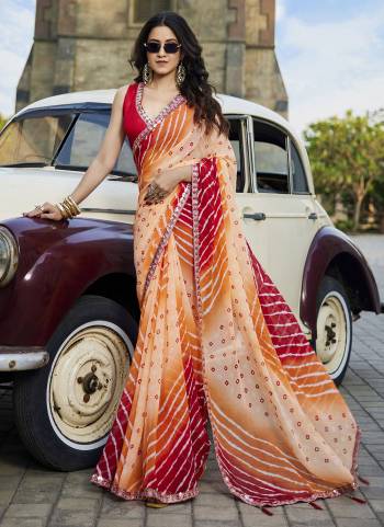 Attractive These Fancy Fastive Saree in Fine Colored.These Saree Are Georgette And Blouse is Fabricated On Art Silk Pair.Its Beautified With Disigner Bandhani,Laheriya Printed With Lace Border Work.