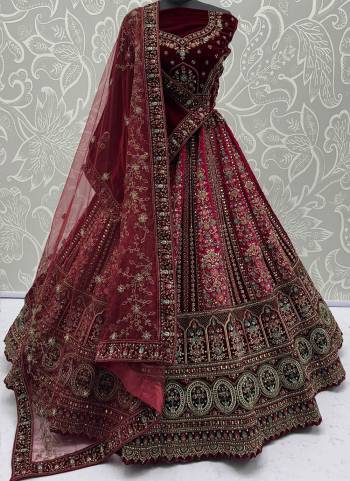 For A Fancy Designer Look,Grab These Lehenga Choli With 2 Dupatta in Fine Colored.These Lehenga And Choli Are Velvet And Dupatta Are Fabricated On Soft Net & Velvet Pair.Its Beautified With Designer Sequance,Mirrar,Dori,Jari Embroidery With Diamond Work. 