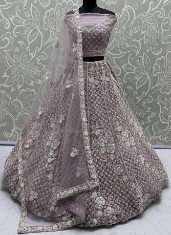 For A Fancy Designer Look,Grab These Lehenga Choli With Dupatta in Fine Colored.These Lehenga And Choli Are Net And Dupatta Are Fabricated On Soft Net Pair.Its Beautified With Fancy Designer Sequance,Dori Embroidery,Crystal Beads Hand Work. 