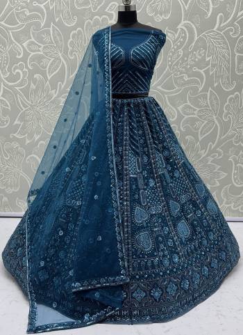 For A Fancy Designer Look,Grab These Lehenga Choli With Dupatta in Fine Colored.These Lehenga And Choli Are Net And Dupatta Are Fabricated On Soft Net Pair.Its Beautified With Fancy Designer Thread,Sequance,Dori Embroidery,Crystal Pipe Hand Work. 