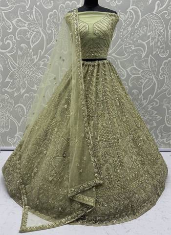For A Fancy Designer Look,Grab These Lehenga Choli With Dupatta in Fine Colored.These Lehenga And Choli Are Net And Dupatta Are Fabricated On Soft Net Pair.Its Beautified With Fancy Designer Thread,Sequance,Dori Embroidery,Crystal Pipe Hand Work. 