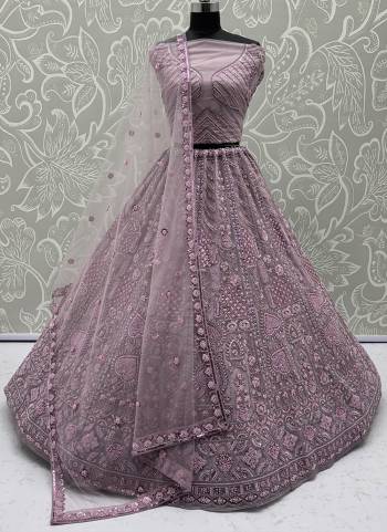 For A Fancy Designer Look,Grab These Lehenga Choli With Dupatta in Fine Colored.These Lehenga And Choli Are Net And Dupatta Are Fabricated On Soft Net Pair.Its Beautified With Fancy Designer Thread,Sequance,Dori Embroidery,Crystal Pipe Hand Work. 