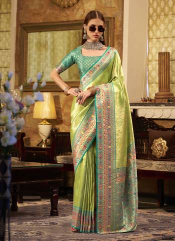 Looking These Party Wear Saree in Fine Colored.These Saree Are Tissue Silk And Blouse is Fabricated On Tissue Silk.Its Beautified With Heavy Woven Jari Designer.