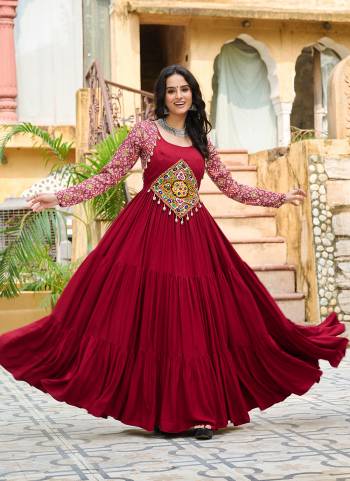 Garb These Beautiful Navratri Wear Readymade Long Gown.These Gown is Fabricated On Rayon.Its Beautified With Designer Kutchi Gamthi Embroidery Work.