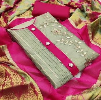 This Designer Suit In Lovely Color.?Its Pretty Top Is Modal Chanderi With Gota Patti Work Based Paired With Santoon Bottom And Banarasi Jacquard Fabricated Dupatta Which Gives An Attractive To The Suit.
