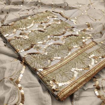 Celebrate This Festive Season In A Proper Look Wearing This Weaved Straight Suit In Fine Color. This Pretty Suit Is Modal Chanderi Based Beautified With Sequance Work. Its Fabric Gives A Rich Look To Your Personality