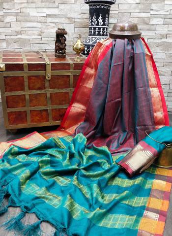 Celebrate This Festive Season In This Very Pretty Fine Colored Designer Saree Paired With Contrasting Colored Blouse. This Saree and Blouse Are Soft Silk Based Beautified With Detailed Wevon Designer Chex Saree. 