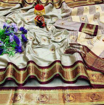 Adorn The Pretty Angelic Look Wearing This Heavy Wevon Paithani Jacquard Designer Saree In Fine Color Paired With Blouse. This Saree Is Fabricated On Cotton Silk Paired With Cotton Silk Fabricated Blouse. Its Pretty Color Pallete Will Give An Attractive Look To Your Personality. 
