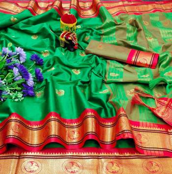 Adorn The Pretty Angelic Look Wearing This Heavy Wevon Paithani Jacquard Designer Saree In Fine Color Paired With Blouse. This Saree Is Fabricated On Cotton Silk Paired With Cotton Silk Fabricated Blouse. Its Pretty Color Pallete Will Give An Attractive Look To Your Personality. 