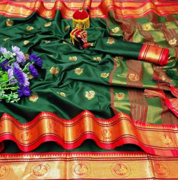 Adorn The Pretty Angelic Look Wearing This Heavy Wevon Paithani Jacquard Designer Saree In Fine Color Paired With Blouse. This Saree Is Fabricated On Cotton Silk Paired With Cotton Silk Fabricated Blouse. Its Pretty Color Pallete Will Give An Attractive Look To Your Personality. 