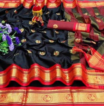 Adorn The Pretty Angelic Look Wearing This Heavy Wevon Paithani Jacquard Designer Saree In Fine Color Paired With Blouse. This Saree Is Fabricated On Cotton Silk Paired With Cotton Silk Fabricated Blouse. Its Pretty Color Pallete Will Give An Attractive Look To Your Personality. 