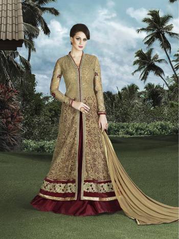 Look The Most Happening Of All This Beige And Maroon Colored Indo-Western Dress. This Dress Is Beautified With Thread Embroidery And Stone Work All Over The Top. Its Top Is Fabricated On Net  Bottom Is In Art Silk And Chiffon Fabricated Dupatta 