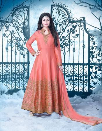 A Must Have Color In Every Womens Wardrobe Which Is In Too Much Demand. Add This Peach Colored Suit To Your Wardrobe And Flaunt Your Beautiful Look Like Never Before. Wear This At Your Next Function And You Will Definitely Earn Lots Of Com[pliemnts Wearing This Pretty Anarakali Floor Length Dress.