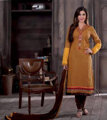 Go Casual This Season With This Cotton Fabricated Dress Material Paired With Chiffon Dupatta. Its Yellow Colored Top Is Paired With Contratsing Brown Colored Bottom And Dupatta. Buy This Lovely Suit Now.