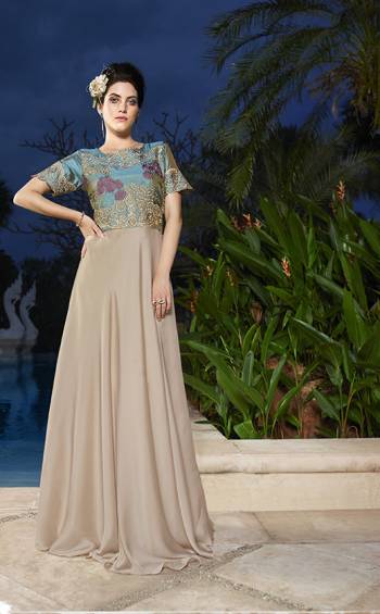 Celebrate This Wedding Season With This Pretty Simple And Elegant Turquoise Blue And Beige Colored Gown Fabricated On Satin Silk. This Designer Gown Is Light In Weight And Easy To Carry All Day Long. Buy Now.