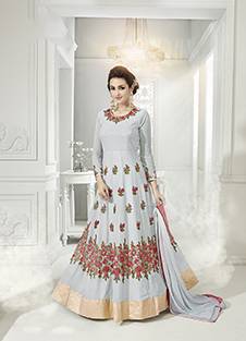 Look Simple And Elegant Wearing This Lovely Light Grey Colored Floor Length Suit Paired With Light Grey Colored Bottom And Dupatta. Its Top Is Fabricated On Georgette Paired With Santoon Bottom And Chiffon Dupatta. It Is Beautified With Thread Embroidery And Stone Work. Buy Now.