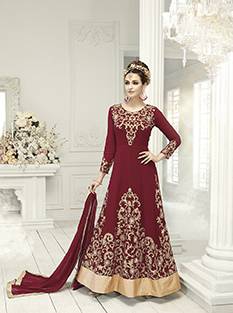 Flaunt Your Rich Taste With This Very Pretty Maroon Colored Anarkali Floor Length Suit. Its Top Is Fabricated On Georgette Paired With Santoon Bottom And Chiffon Dupatta.  It Is Beautified With Jari Embroidery And Mirror Work. Buy This Royal Looking Suit Now.