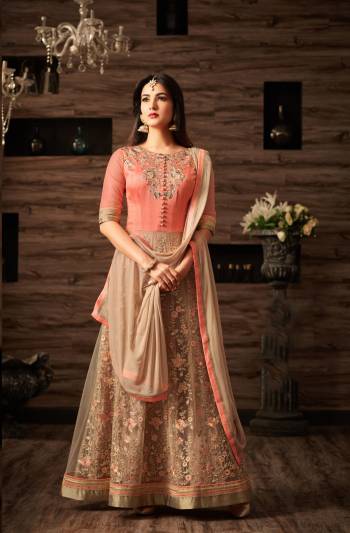 Grab This Amazing Peach And Beige Colored Suit Paired With Beige Colored Bottom And Dupatta. Its Top Is Fabricated On Net And Art Silk Paired With Santoon Bottom And Chiffon Dupatta. This Suit Will Give You A Pretty Amazing Look Like Never Before. Buy This Beautiful Suit Now.