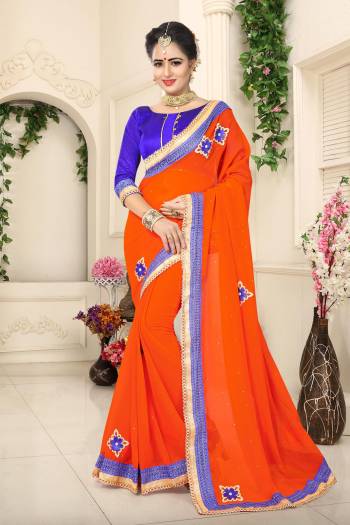 Vibrant Colors Make You Look The Most Attractive Of All. So Grab This Beautiful Orange Colored Saree Paired With Contrasting Blue Colored Blouse. This Saree Is Fabricated On Georgette Paired With Art Silk Fabricated Blouse. It Is Easy To Drape And Carry All Day Long.