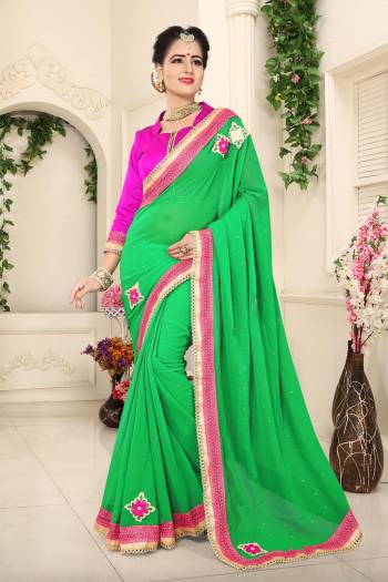 Here Is An Attractive Saree In Green Color Paired With Contrasting Rani Pink Colored Blouse. This Saree Is Fabricated On Georgette Paired With Art Silk Fabricated Blouse. This Saree Is Light In Weight And Easy To Carry All Day Long. Buy It Now.