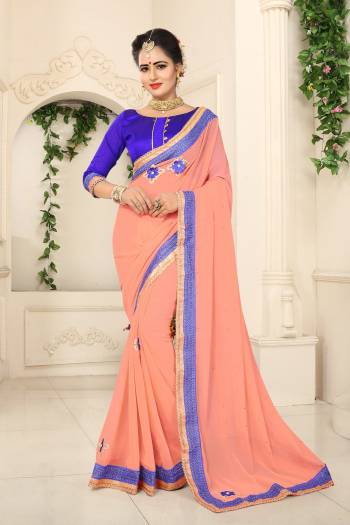 Look Pretty Wearing This Peach Colored Saree Paired With Contrasting Violet Colored Blouse. This Saree Is Fabricated On Georgette Paired With Art Silk Fabricated Blouse. This Saree Is LightIn Weight And Easy To Carry All Day Long.