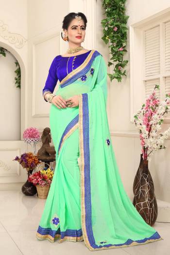 Look Pretty Wearing This Sea Green Colored Saree Paired With Contrasting Violet Colored Blouse. This Saree Is Fabricated On Georgette Paired With Art Silk Fabricated Blouse. It Is Light In Weight And Easy To Carry All Day Long.