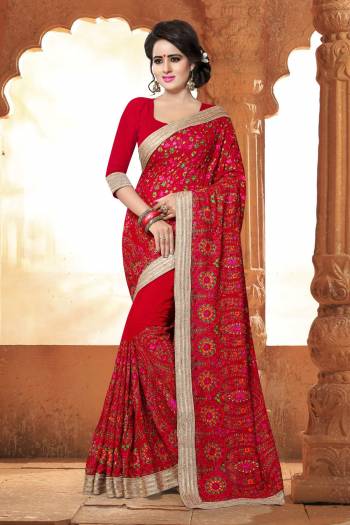 Wear This Red Coloured Georgette Saree at an upcoming special occasion and let all eyes follow you. This Gorgeous Saree Features an Elegantly Stone And Kashmiri Work and Comes with a Georgette Blouse Piece. This Saree is light in weight and will ensure utmost comfort. It will complement gold jewellery and heels.Saree Define Your Nature And Personality Get In Now.