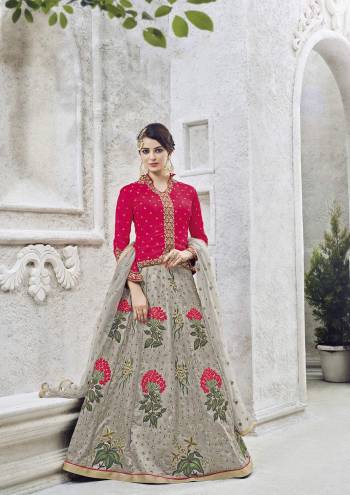 This Dark pink lehenga suit set for your upcomming occasion featuring floral  thread work on the lehenga with stone butti worked jacket is especially designed for women who love ethnic wear. Fashioned from art silk fabric, this set will ensure a comfy fit. Just team this set with high heels.