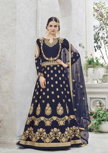 To complement your graceful demeanour, presenting this navy blue salwar suit , featuring golden heavy embroidered work on the front. Fashioned from art silk fabric, This attractive salwar suit set is the flavour of the season and will give you a classy look. Just pair it with high heels.