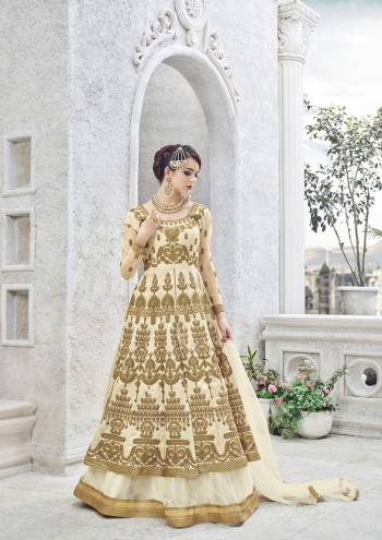 This cream lehenga suit set for your upcomming occasion featuring heavy floral  zardosi and stone work on the lehenga suit is especially designed for women who love ethnic wear. Fashioned from art silk fabric, this set will ensure a comfy fit. Just team this set with high heels.