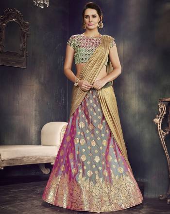 Be an inimitable traditional diva in this dual-tone weaved silk lehenga saree and look majestic as ever. 