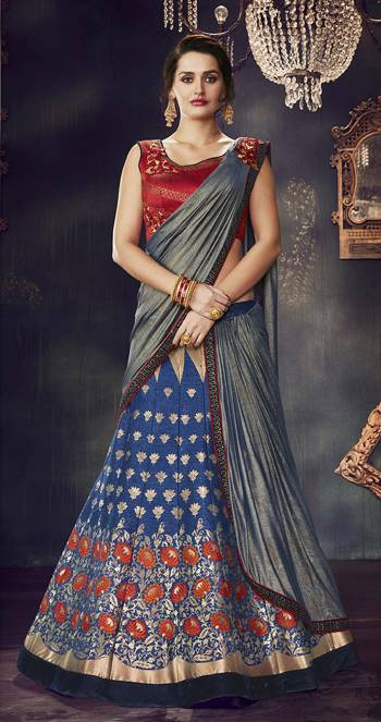 Look gorgeous in this blue lehenga-saree weaved with lotus motifs in threads of gold and shine through the night like a diva. 