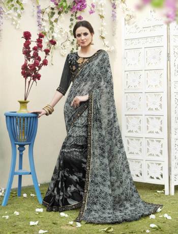 Enhance your Beauty Wearing This Saree In Grey And Black Color Paired With Black Colored Blouse. This Saree Is Fabricated On Georgette Paired With Art Silk Fabricated Blouse. It Is Beautified With Prints all Over The Saree And Embroidery Over The Blouse. 