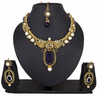 Here Is A Beautiful Necklace To Pair Up With Your Navy Blue Colored Dress. This Lovely Necklace Set Is In Golden Color Beautified With Navy Blue Colored Stones. You Can Also Pair It Up With Any Contrasting Colored Attire.