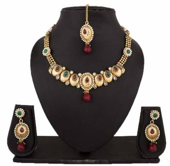 Grab This Attractive Traditonal Looking Necklace Set In Golden Color Beautified With Multi Colored Stones. This Pretty Necklace Has Beautiful Glossy And Matte Finish. This Pretty Set Is Light Weight And Easy To Carry All Day Long.