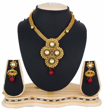 Enhance Your Traditonal Look Pairing It With This Beautiful Necklace Set In Golden Color Beautified With Maroon Colored Stones. This Pretty Set Is Light Weight And Easy To Carry Throughout The Gala.