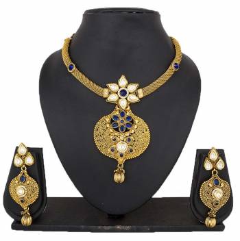 Here Is A Beautiful Necklace To Pair Up With Your Navy Blue Colored Dress. This Lovely Necklace Set Is In Golden Color Beautified With Navy Blue Colored Stones. You Can Also Pair It Up With Any Contrasting Colored Attire.