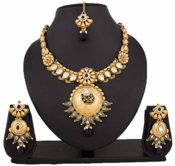 Here Is A Beautiful Necklace To Pair Up With Your Navy Blue Colored Dress. This Lovely Necklace Set Is In Golden Color Beautified With Navy Blue Colored Stones. You Can Also Pair It Up With Any Contrasting Colored Attire.