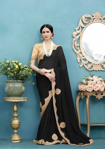 Enhance Your Beauty Wearing This Elegant Designer Saree In Black Color Paired With Beige Colored Blouse. This Saree Is Fabricated On Georgette Paired With Art Silk Fabricated Blouse. Its Attractive Embroidery Will Definitely Earn You Lots Of Compliments From Onlookers.