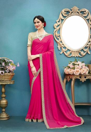 Bright And Visually Appealing Saree Is Here In Fuschia Pink Color Paired With Beige Colored Blouse. This Saree Is Fabricated On Georgette Paired With Art Silk Fabricated Blouse. Its Beautiful Stone Work And Elegant Lace Border Will Earn You Lots Of Compliemnts From Onlookers.